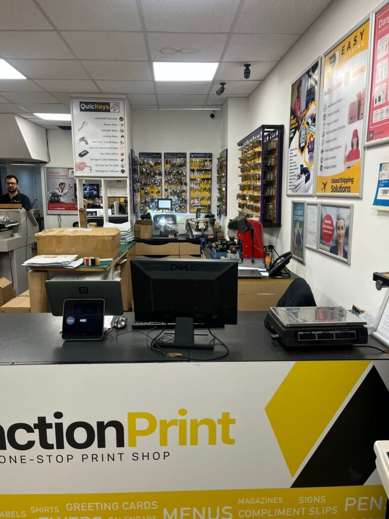 Printing staff at Clapham Junction Print reviewing designs for London events and local businesses